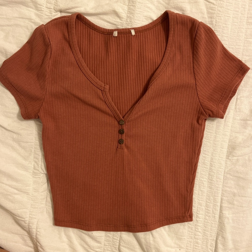cute salmon color top with buttons